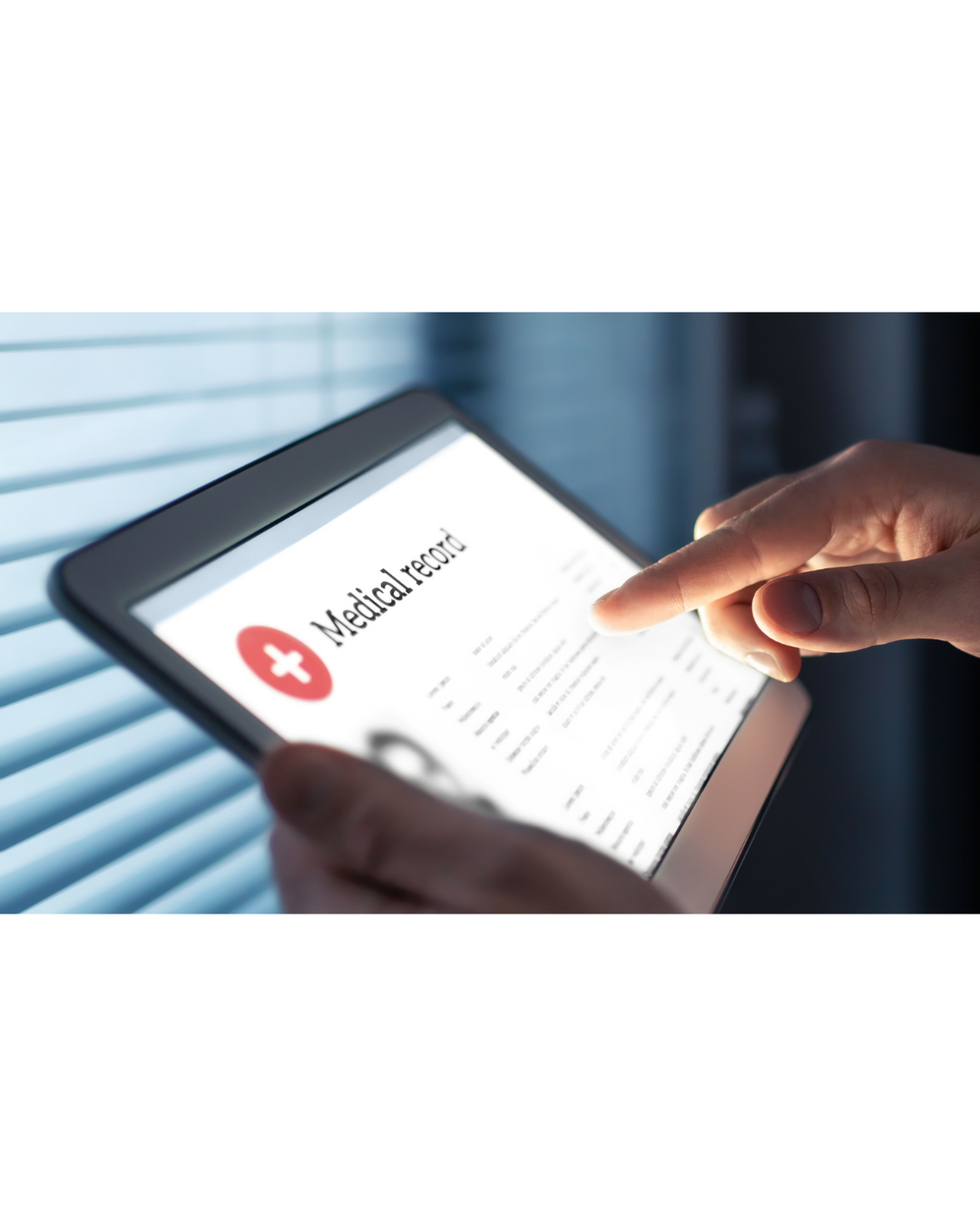 A patient holding a tablet with a medical record on the screen.